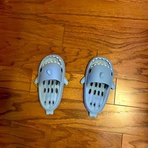 Never worn shark slides. Baby blue
